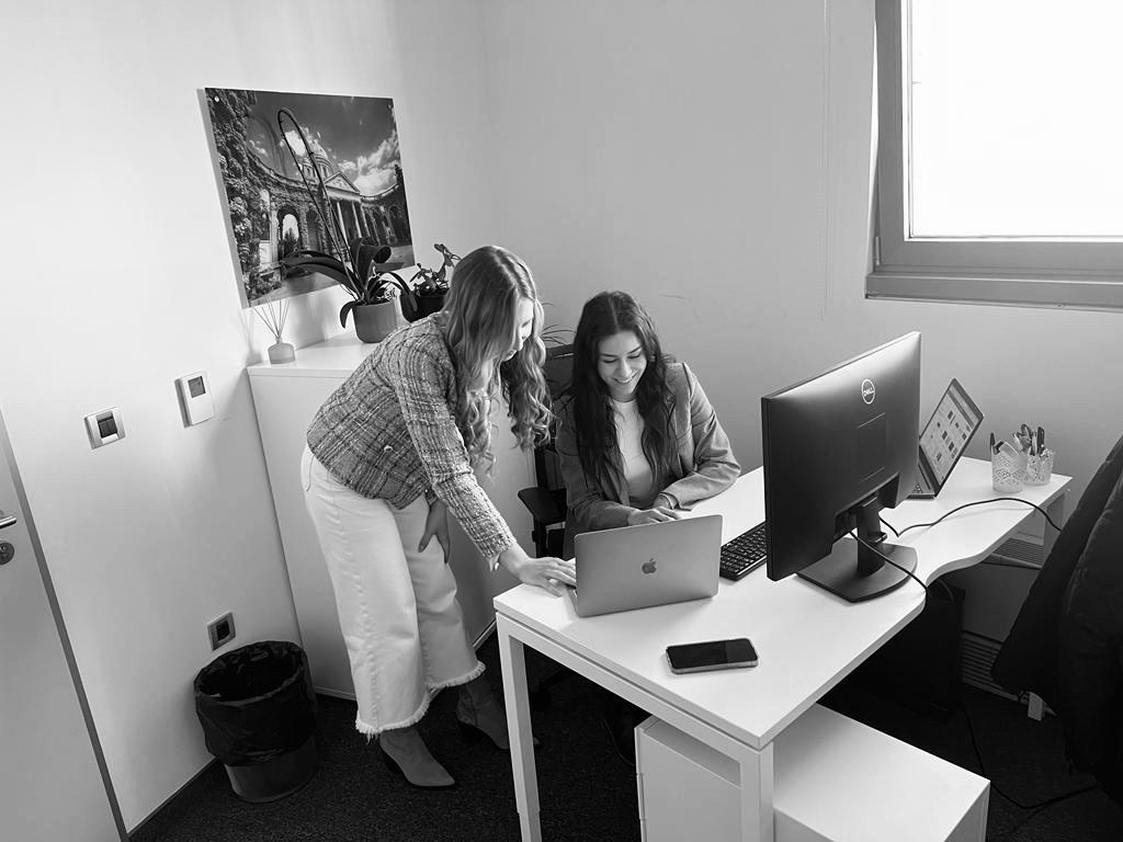 Two Rubycode colleagues going through work at a desk in the Zagreb office